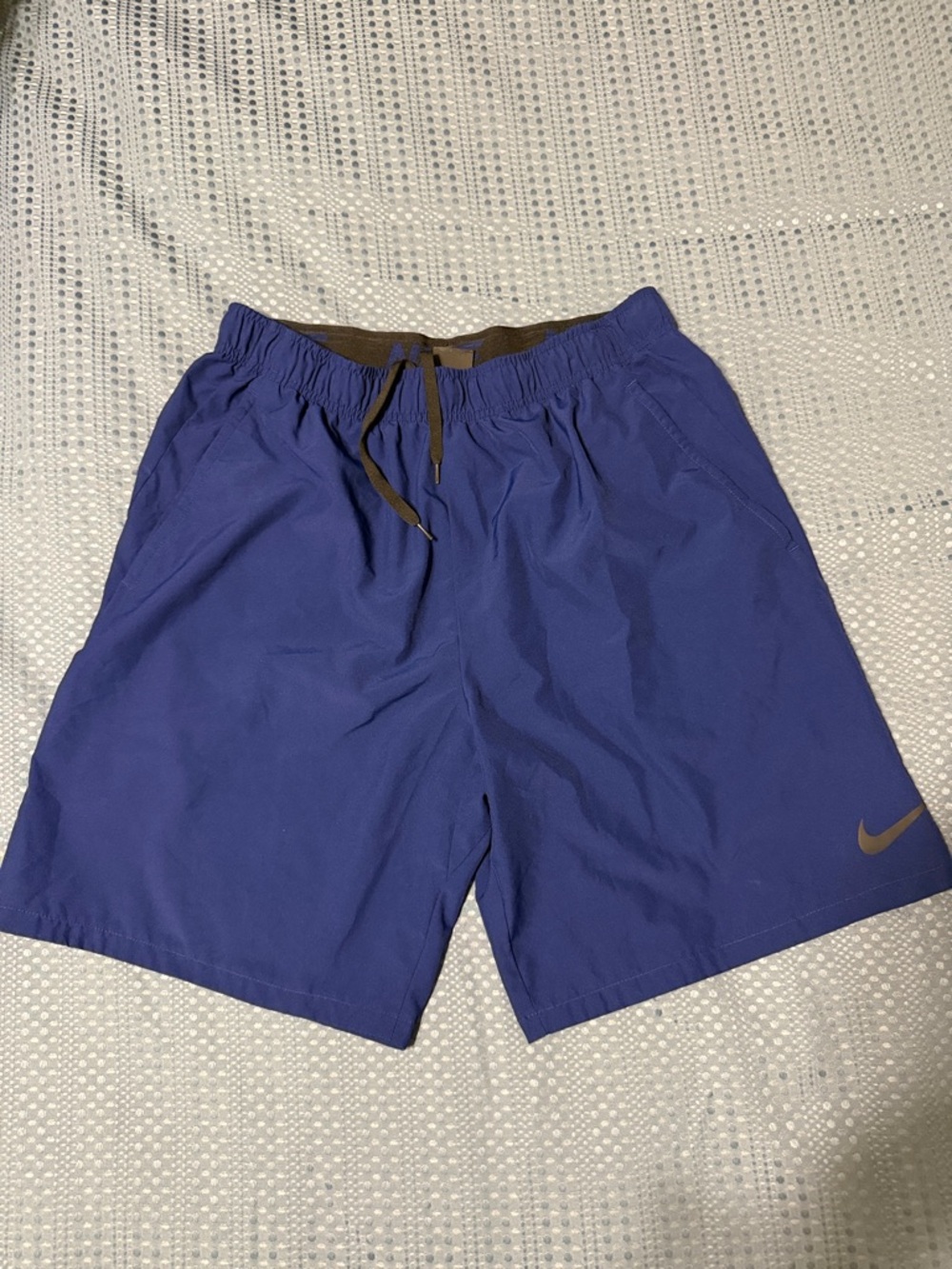 Nike Blue Athletic Shorts with Brown Swoosh